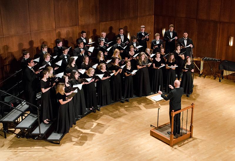 A choir sings in the Clare and Josef Meier recital hall.
